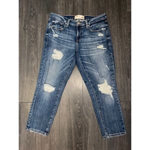 Blue distressed denim mom jeans from Garage .